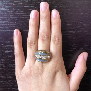 Gray golden ring with diamonds